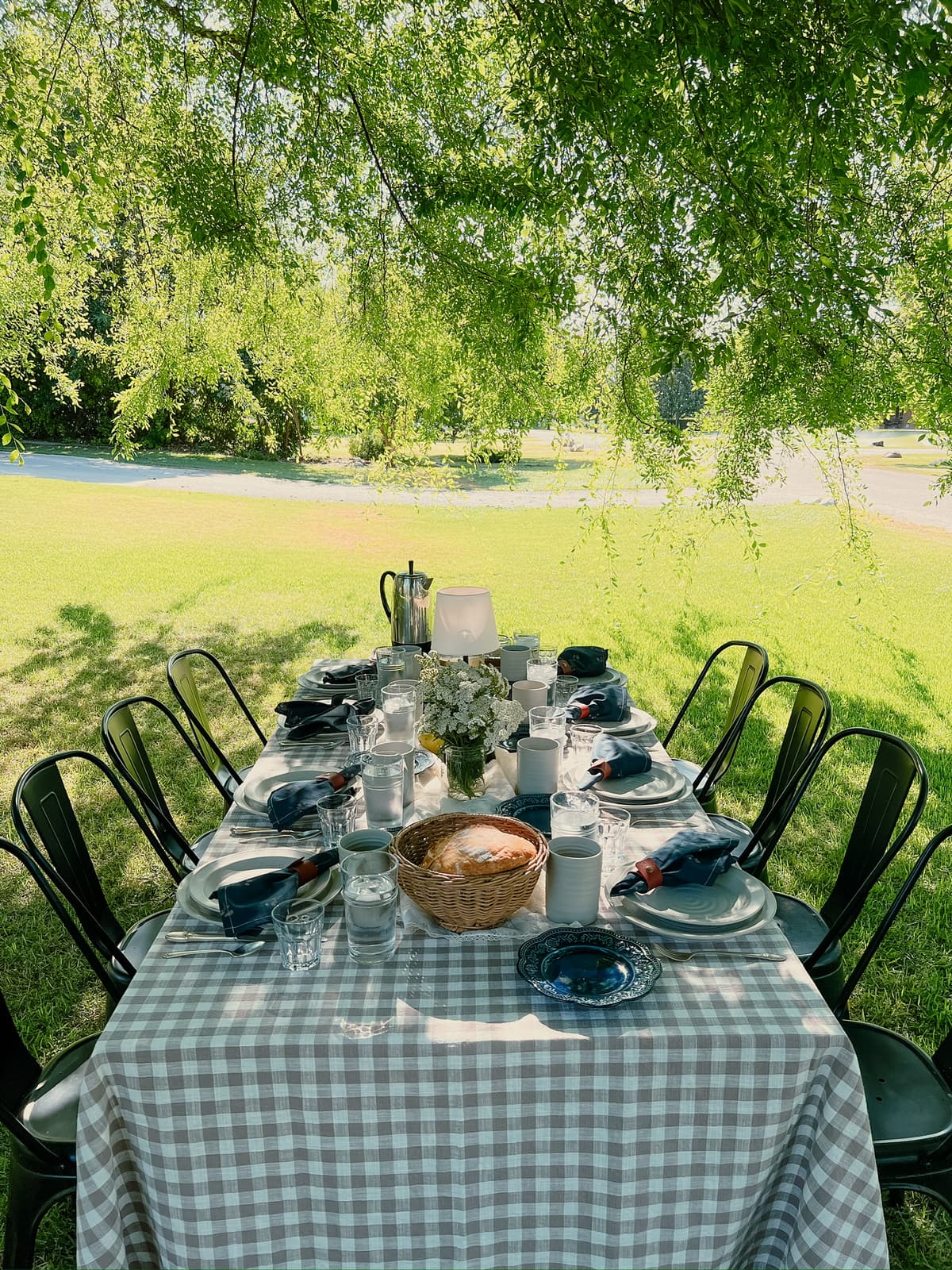 Chic table setting with minimalist decor and vintage tableware for intimate gathering in Bakersfield