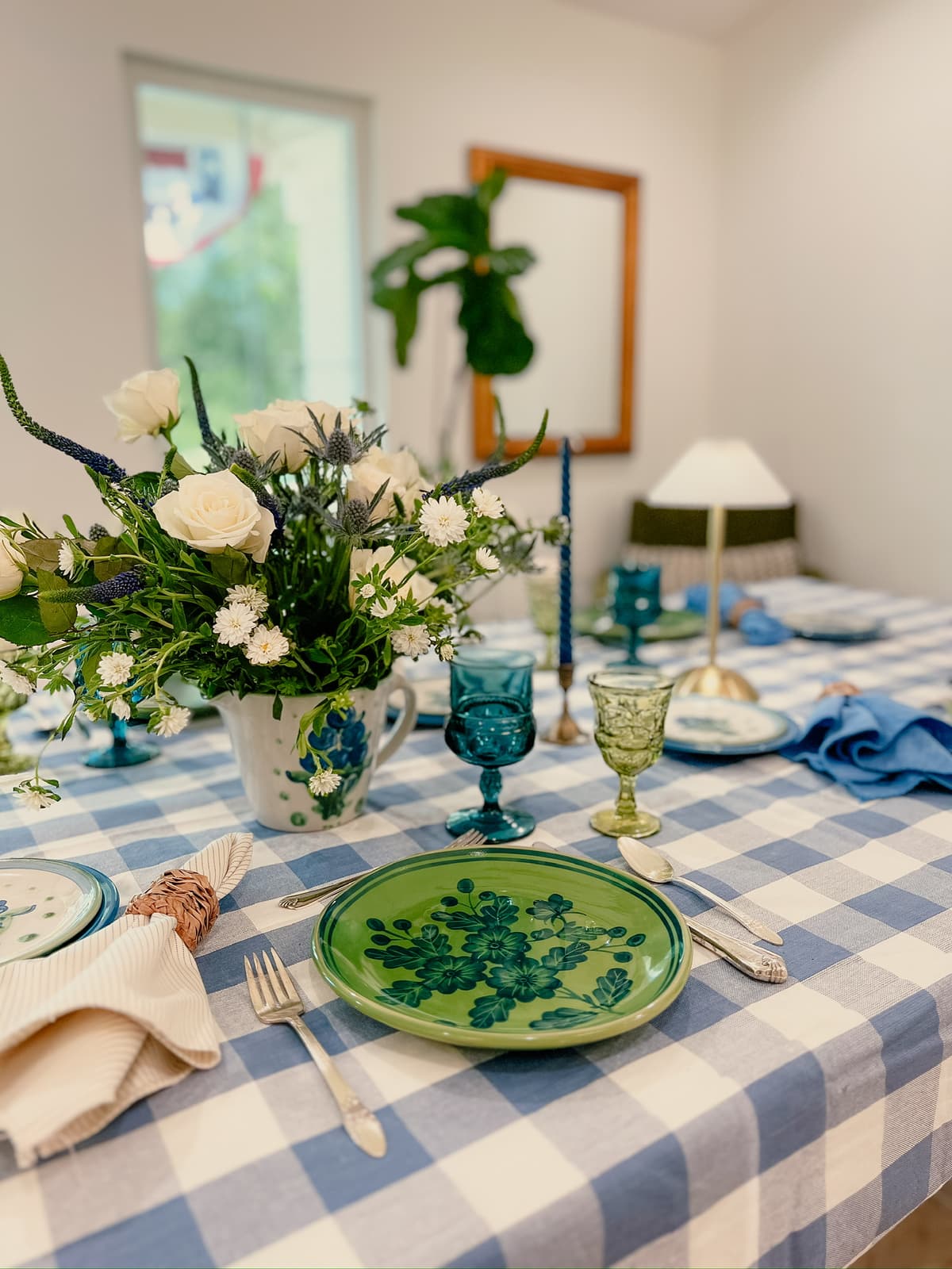 Charming picnic-inspired table setting with vintage tableware and outdoor elements for intimate gathering in Bakersfield