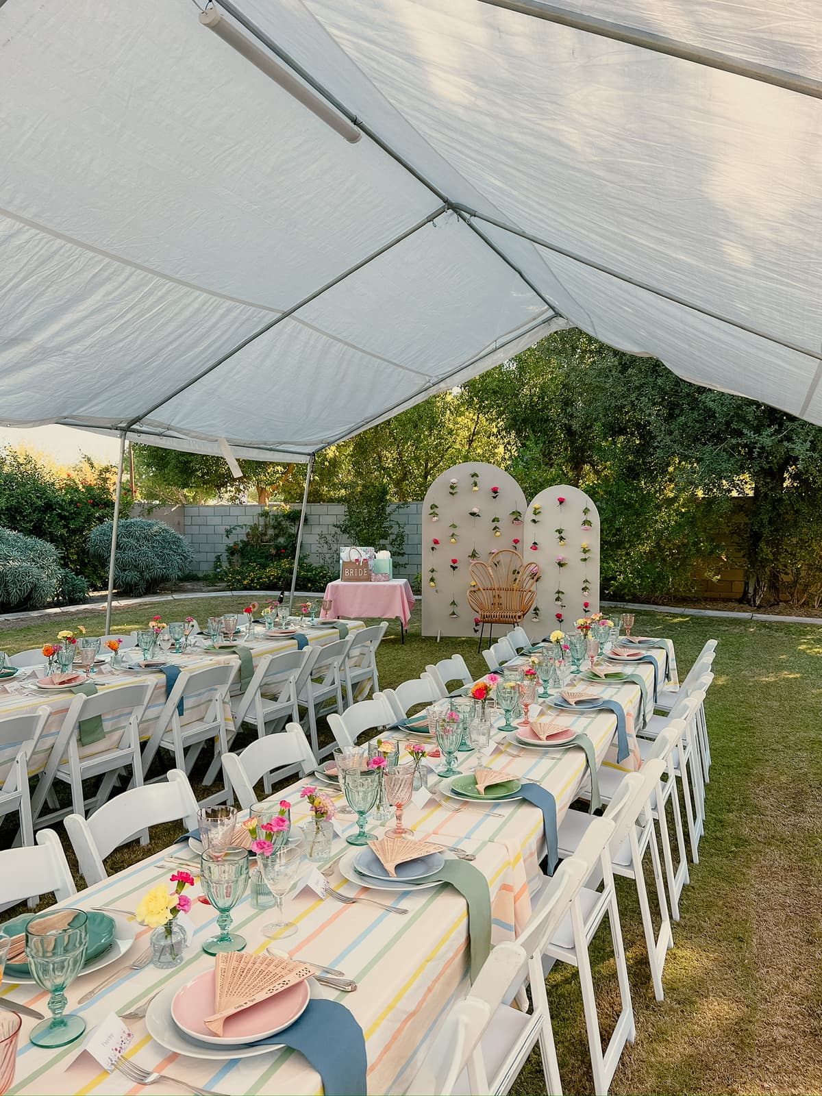 Charming vintage table setting with lace tablecloth and pastel dishes