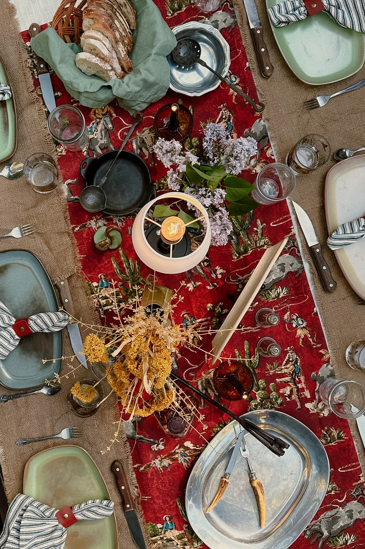 Beautiful table setting with vintage blueberry china, blue gingham tablecloth, and colorful glassware for intimate gathering in Bakersfield