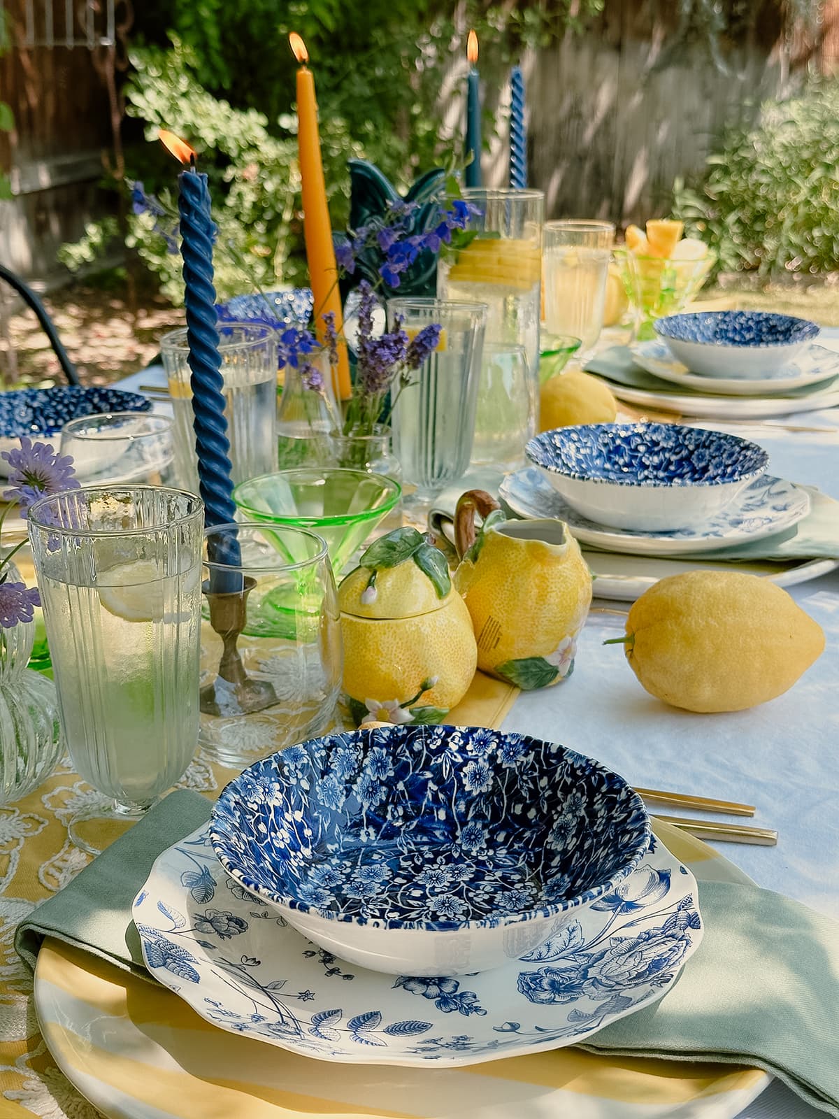 Lemon-themed vintage table setting with yellow china, lemon centerpiece, and rustic decor for intimate gathering in Bakersfield